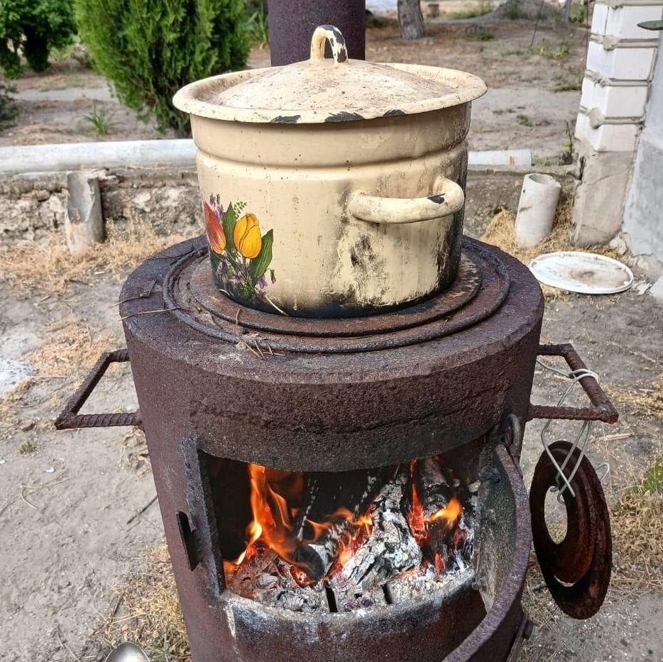 Image caption,Oleshky has been without gas or electricity since 2023, so residents have had to find other solutions