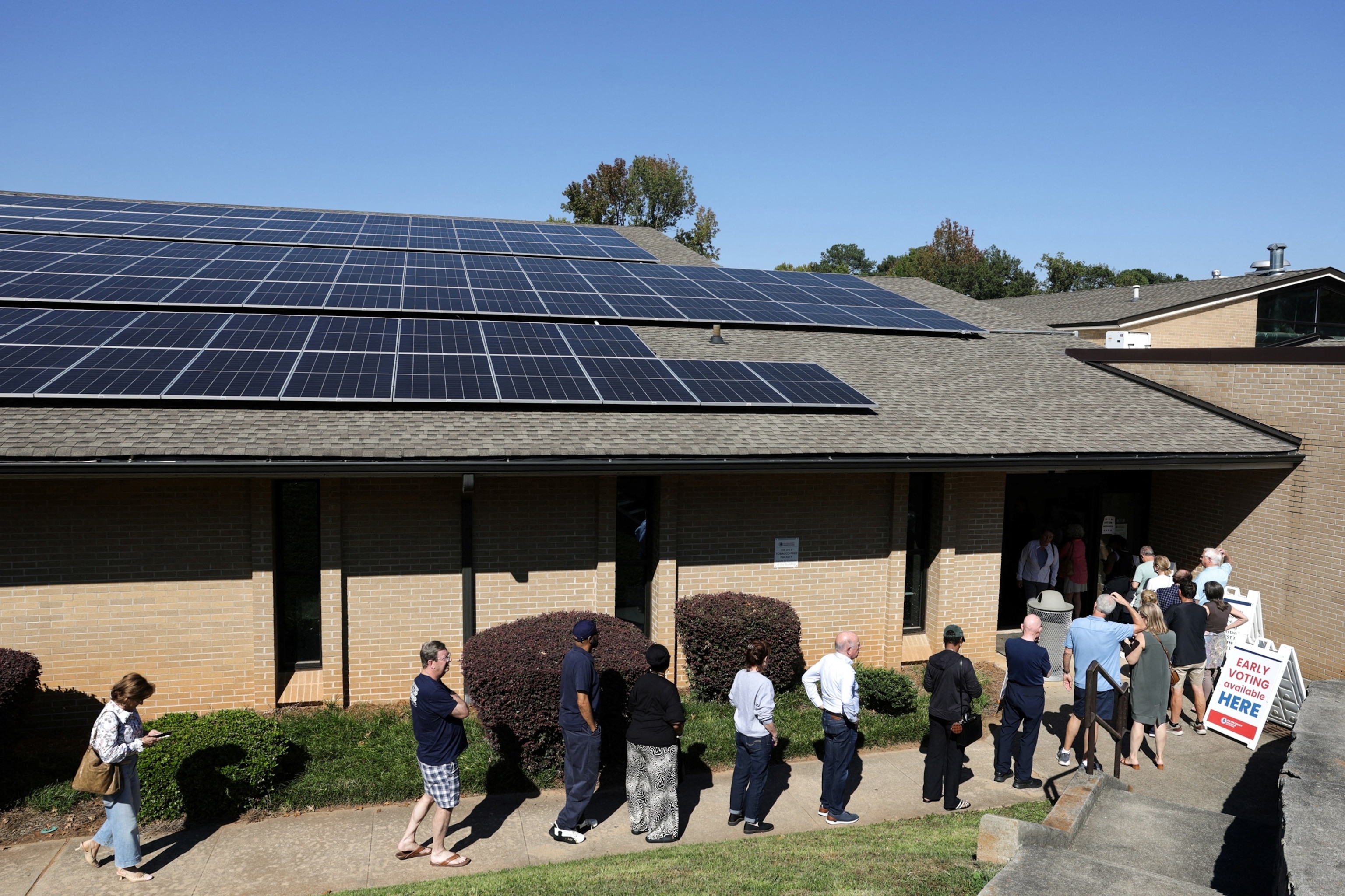 Voters wait in line to participate in early voting, which includes midterm races for governor and a US Senate seat, at a polling place at the Sandy Springs public library in Atlanta, Georgia, Oct. 14, 2026.Jonathan Ernst/Reuters