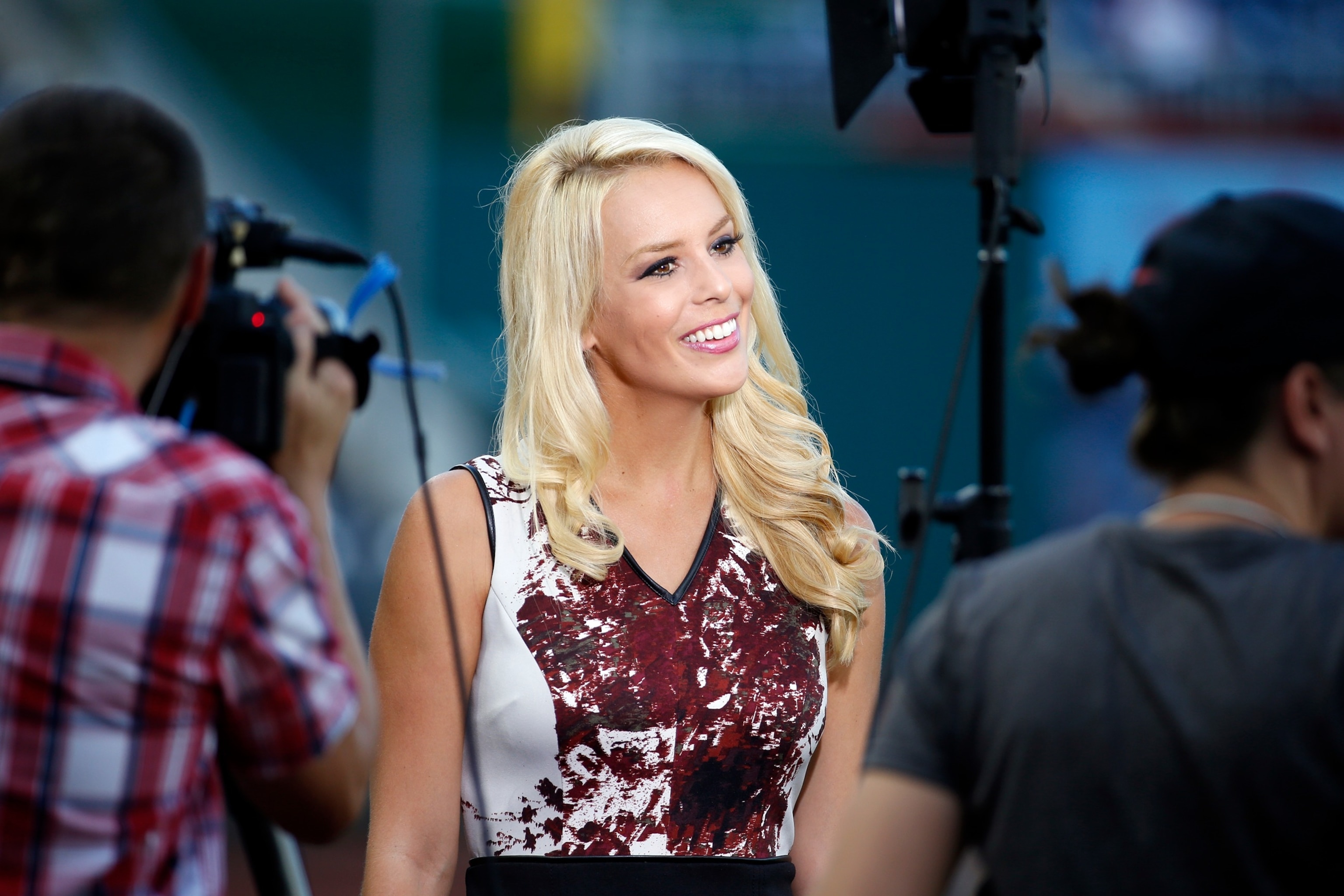 In this Sept. 8, 2015, file photo, ESPN television reporter Britt McHenry smiles before a baseball game between the Washington Nationals and the New York Mets at Nationals Park in Washington, D.C.Alex Brandon/AP