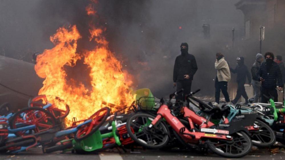 Image caption,Largely peaceful demonstrations in Paris organised by students and unions devolved into rioting and looting as last Saturday wore on