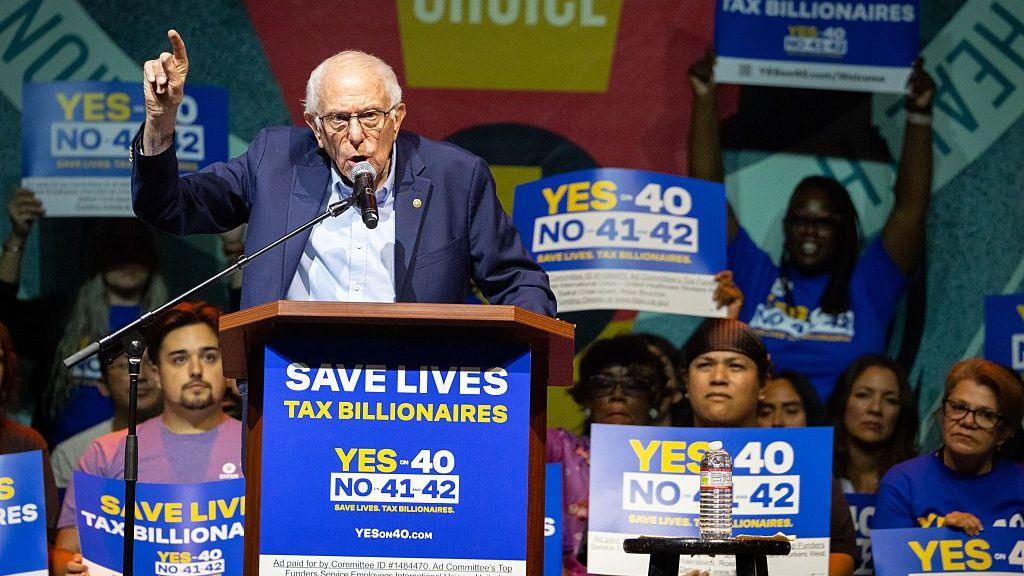 Image caption,US Senator Bernie Sanders speaks at the "Ballots Over Billionaires" rally on 5 October in Los Angeles.