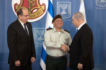 Itamar Ben-Gvir, centre, the leader of the Jewish Power party, on the campaign trail in Ramla. The far-right politician is calling for more Jewish settlements in the West Bank and harsh measures against Palestinians.Photograph: Amir Cohen/Reuters