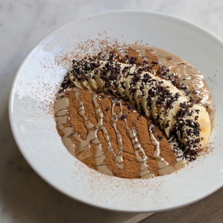 Five-grain porridge with banana, tahini, honey, cinnamon, sesame and cacao nibs at 26 Grains.Photograph: 26 Grains