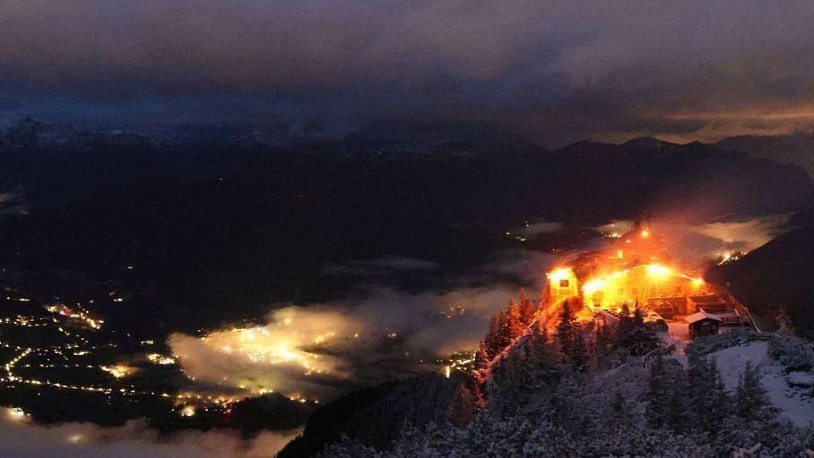 Image caption,The retreat was seen smouldering on Saturday morning
