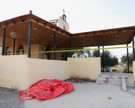 The scene at St George’s Greek Orthodox church in Hamoud on Saturday, where gunmen opened fire during a funeral.Photograph: Alaa Al Sukhni/Reuters