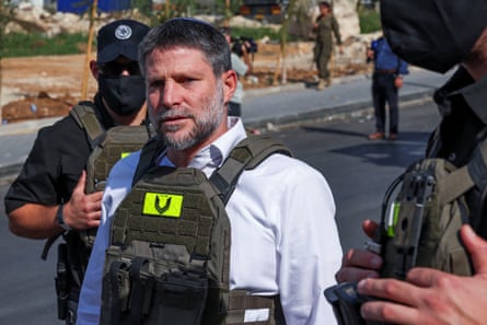 Israel’s finance minister, Bezalel Smotrich, filmed himself wearing body armour in front of a Palestinian building being demolished.Photograph: Ammar Awad/Reuters