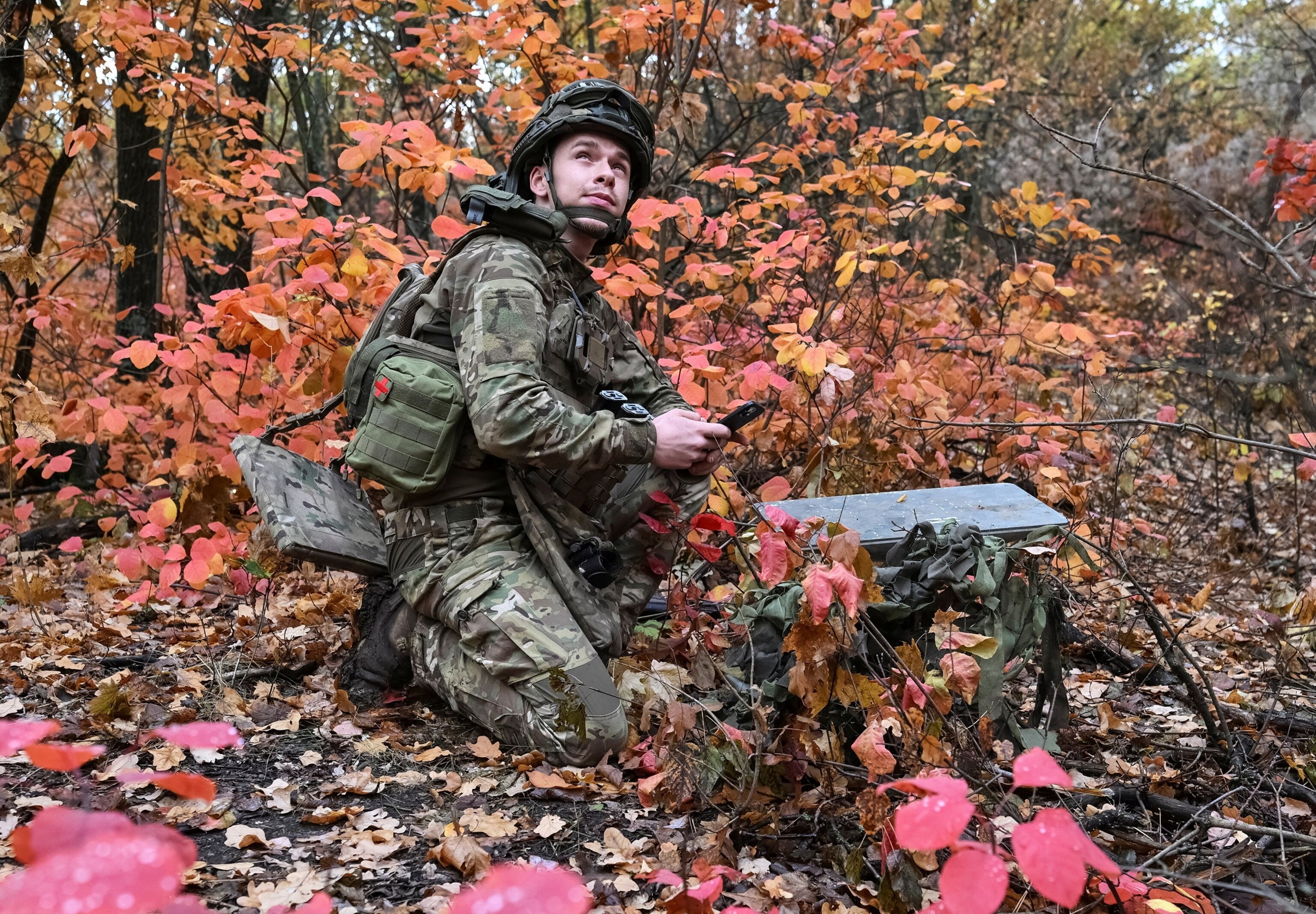 An artilleryman of the Special Rifle Police Battalion of Zaporizhzhia region sets up Starlink satellite internet system, at a position, amid Russia's attack on Ukraine, near the frontline in Donetsk region, Ukraine, Oct. 16, 2026.Stringer via Reuters