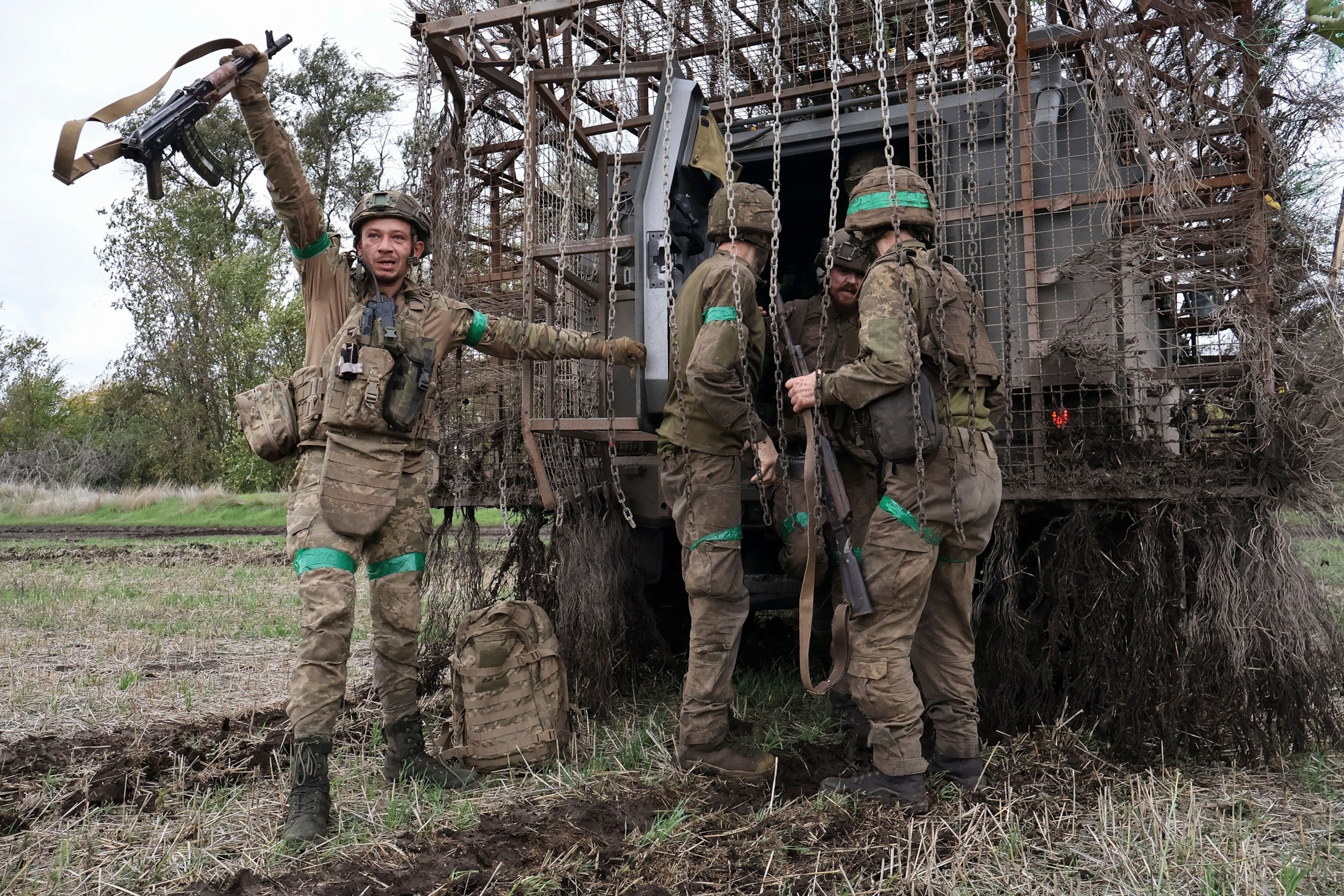 A handout photo made available by the press service of the 65th Separate Mechanized Brigade of the Ukrainian Armed Forces shows brigade members welcoming other brigade members near the front line in the Zaporizhzhia region, Ukraine, Oct. 19, 202665th Mechanized Brigade Press Service Handout via EPA via Shutterstock