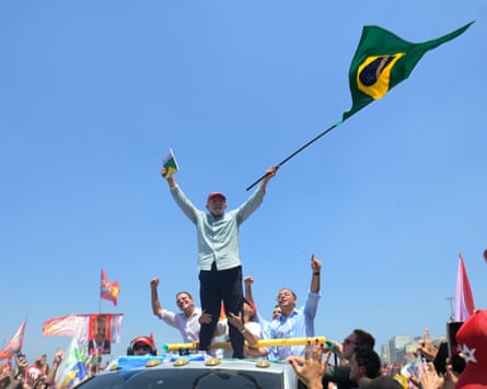 Luiz Inácio Lula da Silva waves to supporters on Saturday.Photograph: Dhavid Normando/AP