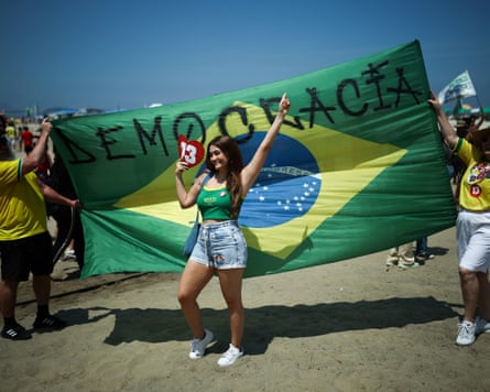Lula supporters on Copacabana Beach in Rio de Janeiro.Photograph: Agustín Marcarian/Reuters