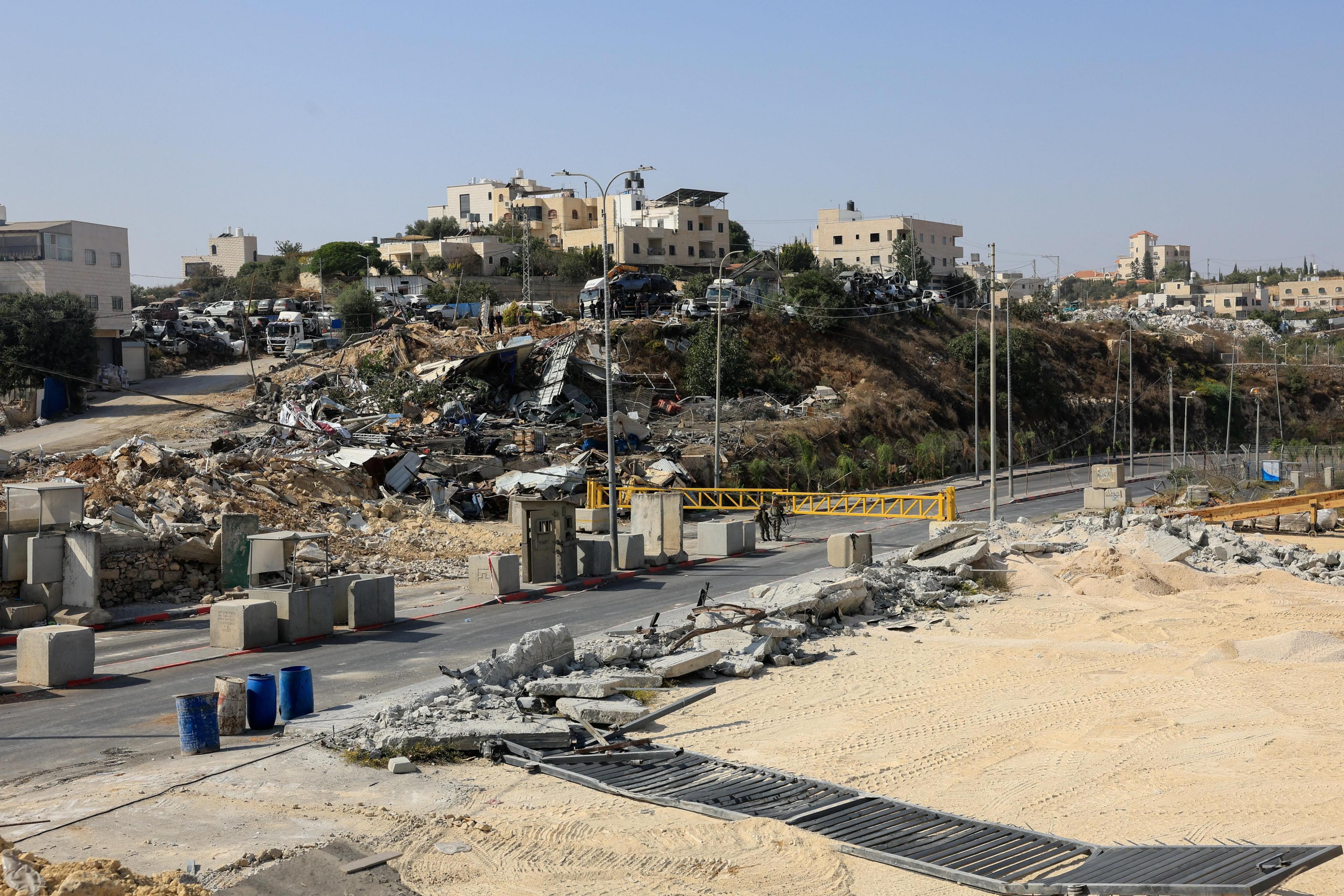 Image caption,Wreckage was seen around the site of Friday's shooting following demolitions by Israeli forces