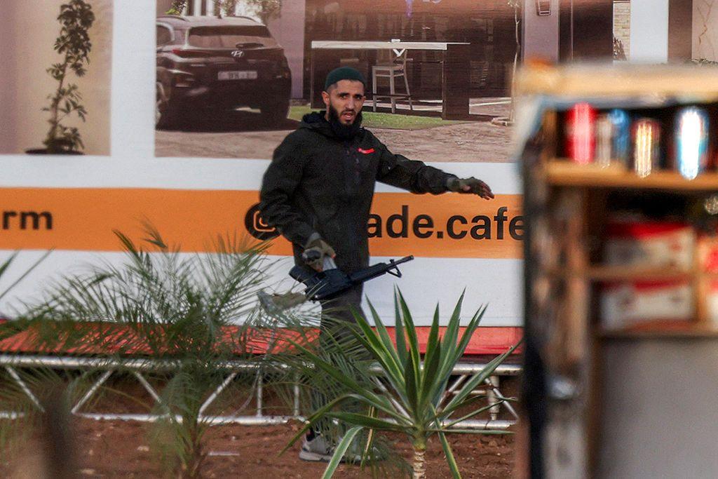 Image caption,Photos of one of the suspected gunmen in Friday's attack were shared by AFP news agency