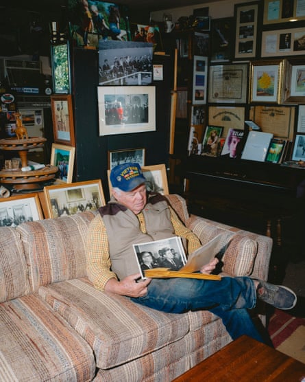 Pat Carr looks through photographs at his home in Cottonwood, California.Photograph: Mason Trinca/Mason Trinca for The Guardian