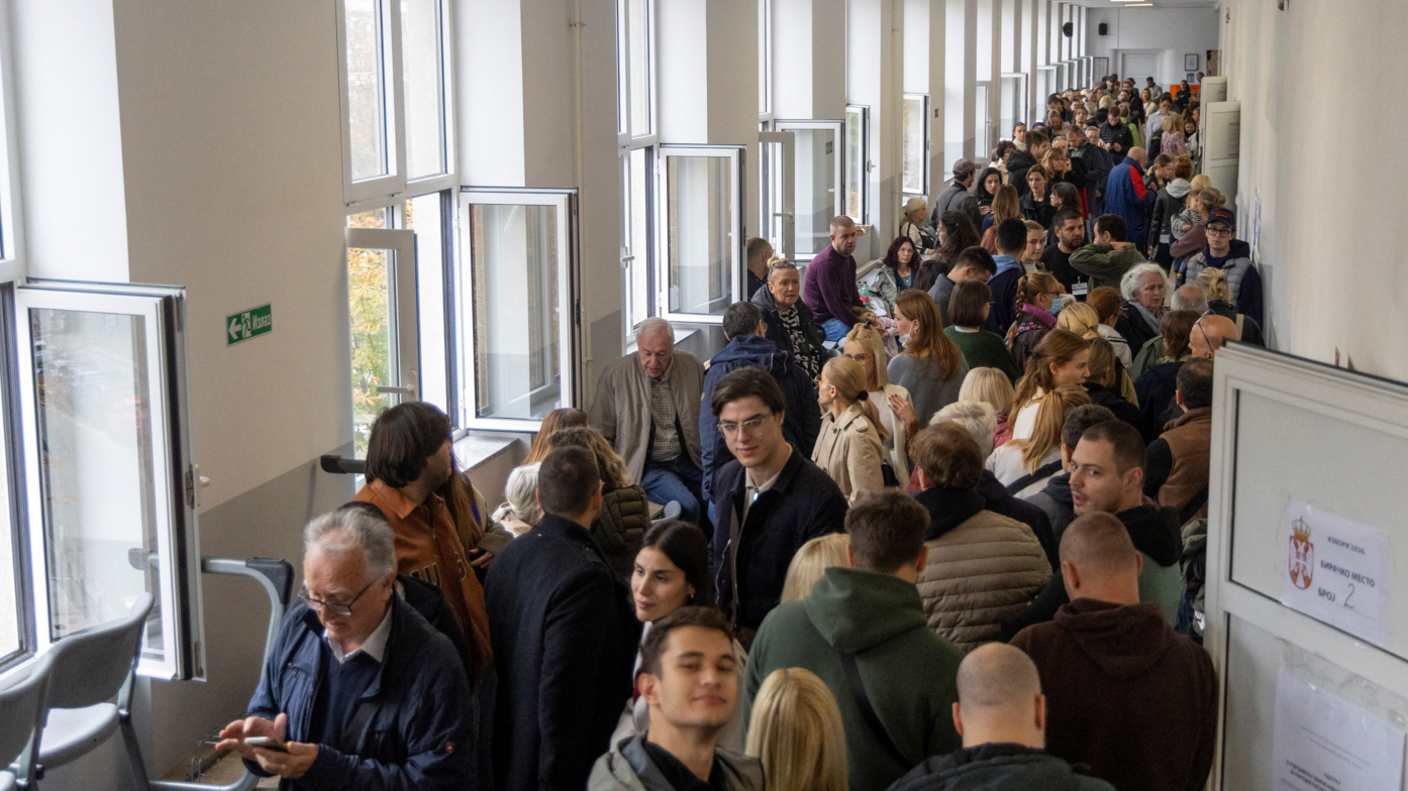 Image caption,People wait in line to cast their votes in capital Belgrade