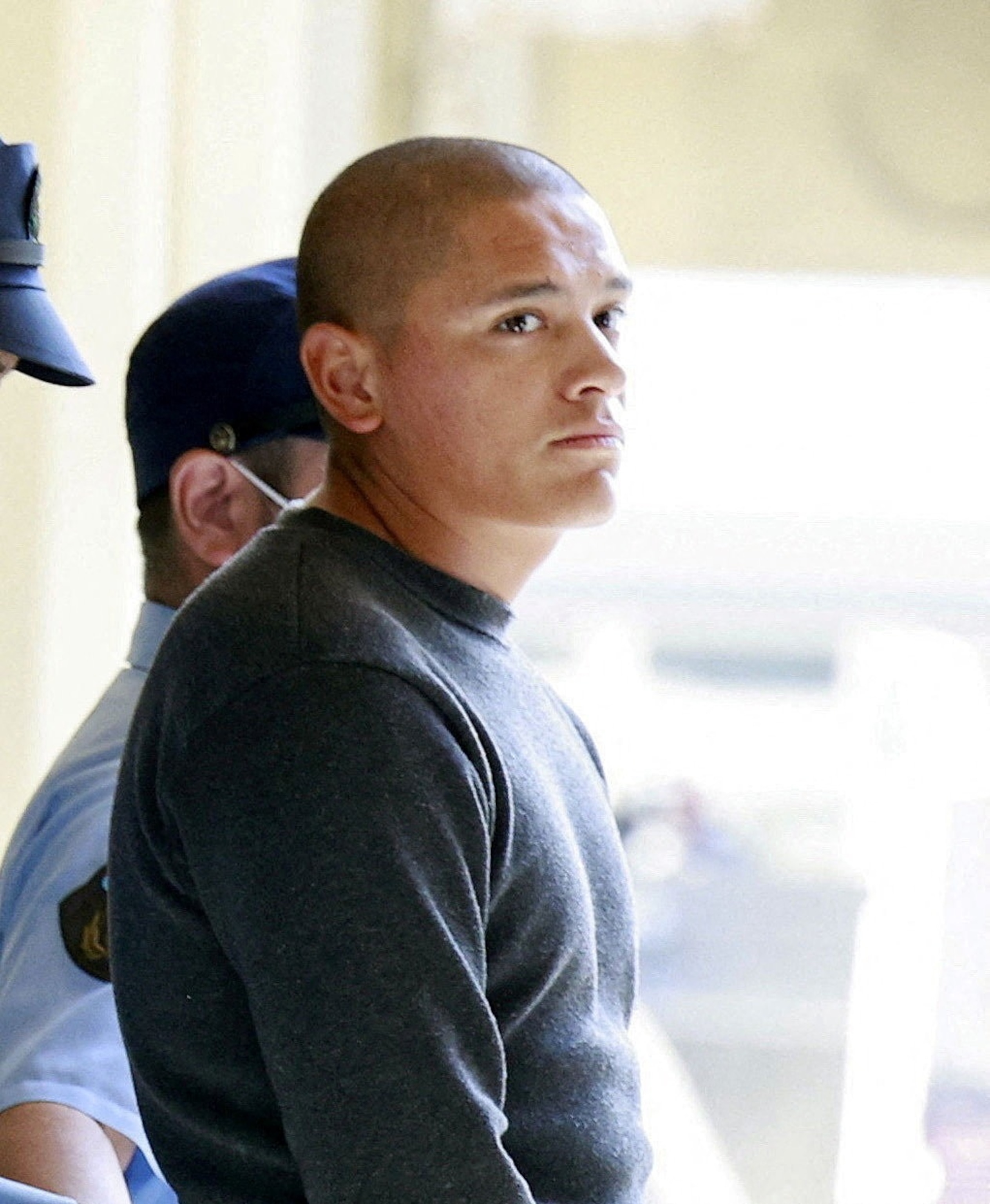 Marine Lance Corporal Devin Jacob Ballard leaves a police station to be sent to prosecutors over the killing of a Japanese woman in Naha, Okinawa Prefecture, Japan, October 5, 2026 in this photo taken by Kyodo.Kyodo via Reuters