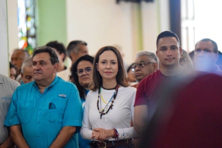 Machado attended a religious ceremony at the Divina Pastora shrine in Barquisimeto, where supporters of her Vente Venezuela party embraced her during mass.Photograph: Jose Miguel Alarcon/EPA