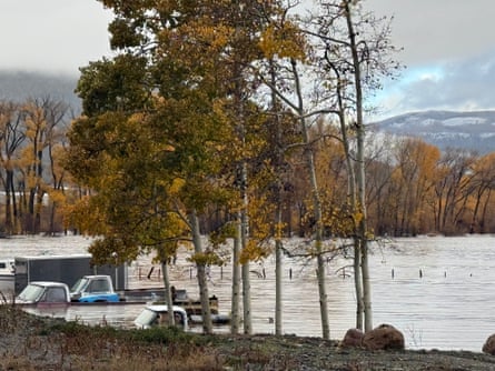 Pickup trucks are submerged along Highway 160 in South Fork, Colorado, on Friday.Photograph: South Fork Fire Rescue/AP