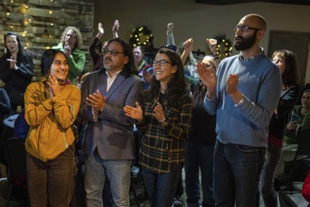 Mary Peltola, center, celebrates with her family and supporters as ranked-choice tabulations were announced in November 2022 in Anchorage, Alaska.Photograph: Loren Holmes/AP