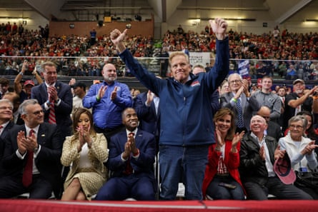 Brian Pannebecker, the Auto Workers for Trump founder, stands with Donald Trump during a Mike Rogers rally in Port Huron, Michigan, on Sunday.Photograph: Jonathan Ernst/Reuters