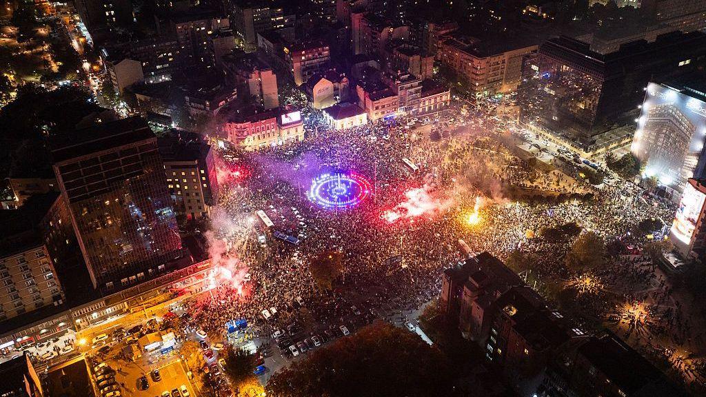 Image caption,An aerial photo shows the size of the celebrations by Students' List supporters at  Slavija square in Belgrade
