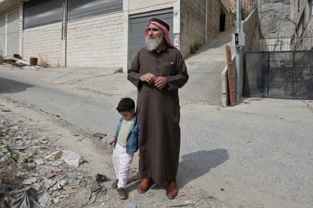 Fahed Ahmaro, who was forced to flee his home in the Deir Baha area of Hebron by Israeli security forces, looks at his house from a distance.Photograph: Quique Kierszenbaum/The Guardian