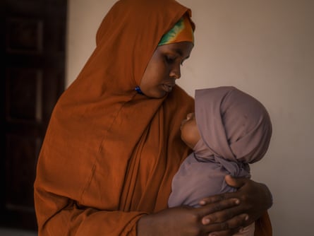 Cayni Ali with her child Mandeq at a health centre in Kismayo, Somalia.Photograph: Hugh Kinsella Cunningham