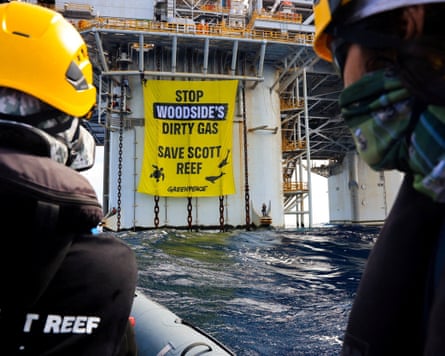Greenpeace activists protesting Woodside’s proposed Browse project on Scott Reef deploy a  banner at the company’s Scarborough gas platform off the coast of Western Australia on 17 October.Photograph: Greenpeace/Reuters