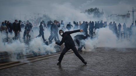 Police and protesters exchange teargas and fireworks in demonstrations across France – video