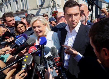 Marine Le Pen with the RN president, Jordan Bardella, campaigning on 8 July.Photograph: Fred Tanneau/AFP/Getty