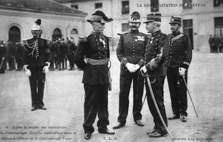 Alfred Dreyfus (second right) speaks with General Gillain after he awarded Dreyfus the Legion d’honneur at the École Militaire in Paris in July 1906.Photograph: AFP/Getty Images