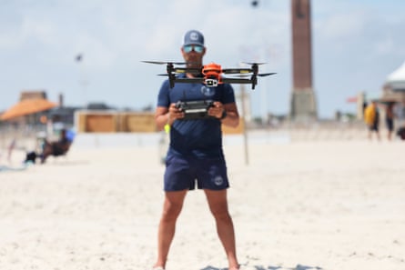 Lifeguarding supervisor Cary Epstein operates a new shark-monitoring drone at Jones Beach state park in Wantagh, New York.Photograph: Michael M Santiago/Getty Images