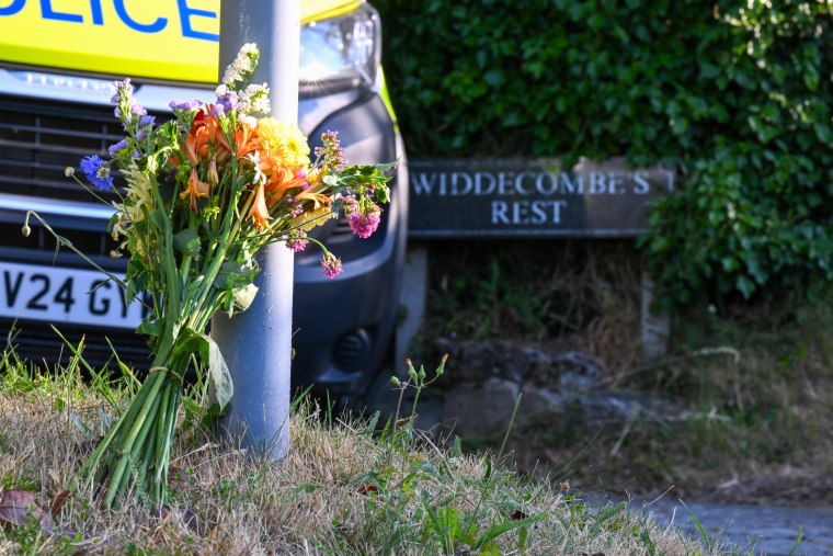 Flowers are seen outside the house of Ann Widdecombe in Haytor in Dartmoor, England, on July 11.Finnbarr Webster / Getty Images
