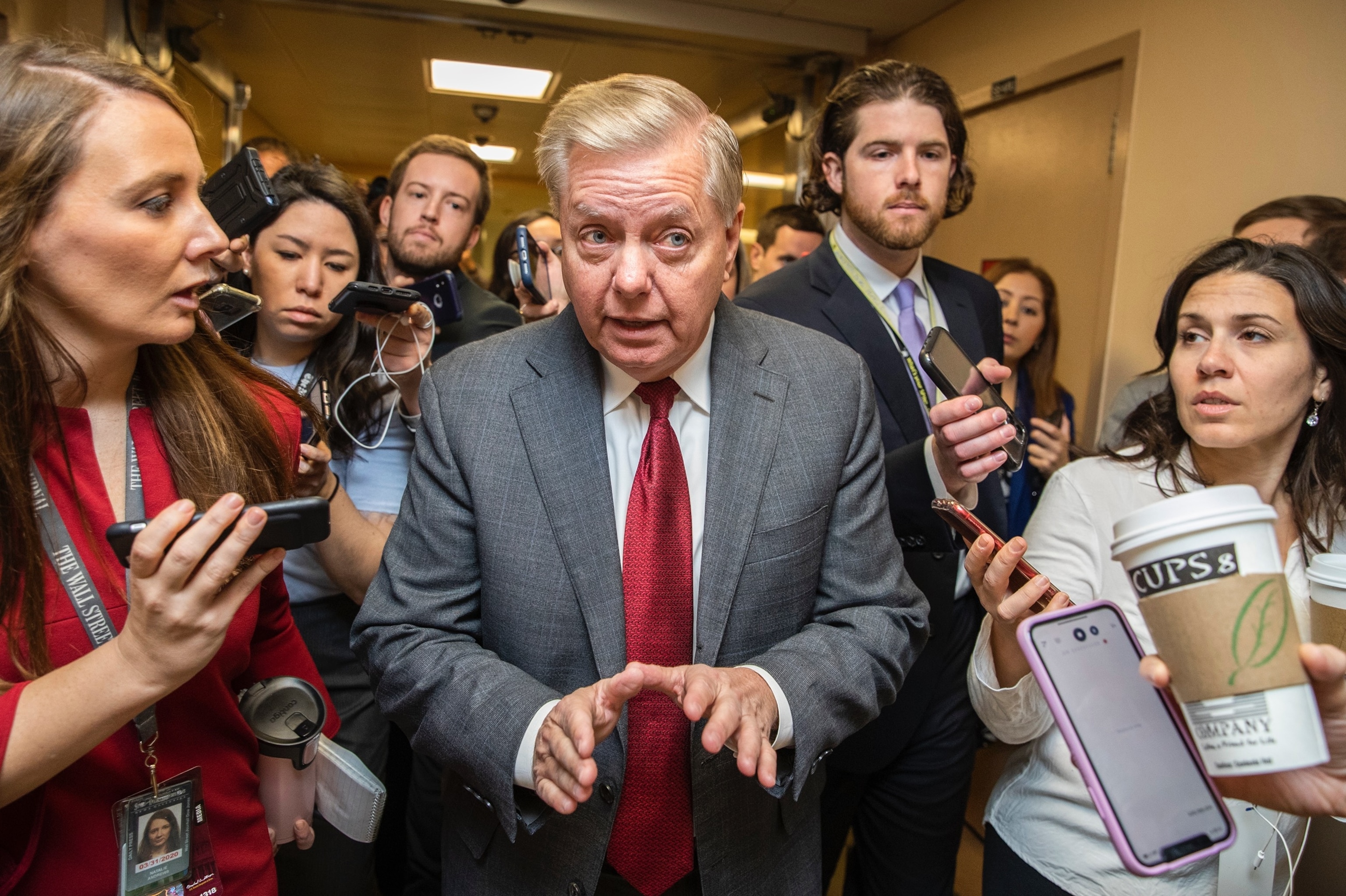 Sen. Lindsey Graham speaks to reporters as he arrives at the Capitol during the impeachment trial of President Donald Trump on charges of abuse of power and obstruction of Congress, in Washington, Jan. 27, 2020.Manuel Balce Ceneta/AP