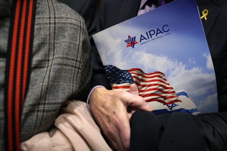 A visitor holds an Aipac folder in an elevator on Capitol Hill.Photograph: Alex Wong/Getty Images