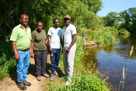 ‘A long way from the Home Office.’ Solomon, Aliya, Abdullah and Doudou beside the River Dee.Photograph: Christopher Thomond/The Guardian