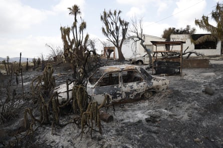 A burnt-out car after wildfires in Spain’s Almería province.Photograph: Pablo Blázquez Domínguez/Getty Images