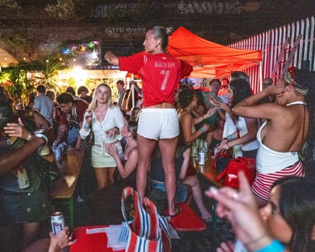 England fans at the Carpet Shop in Peckham, south London.Photograph: Andy Hall/The Guardian
