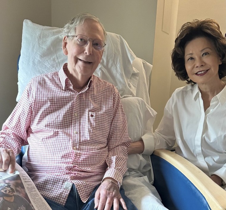 An image provided Sunday by McConnell's office shows him reclined in a hospital chair with his wife, Elaine Chao.via office of Mitch McConnell