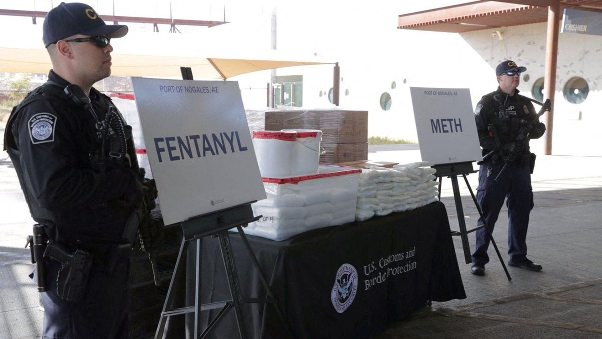 Image caption,US Customs and Border Protection staff display fentanyl and methamphetamine seized from a truck crossing from Mexico into Arizona