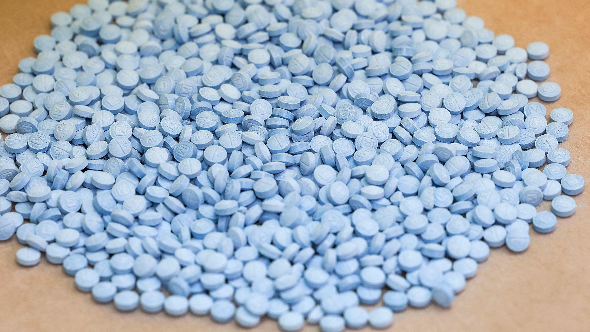Image caption,Illegally produced fentanyl is often sold as pills - displayed here by the US Drug Enforcement Administration in New York