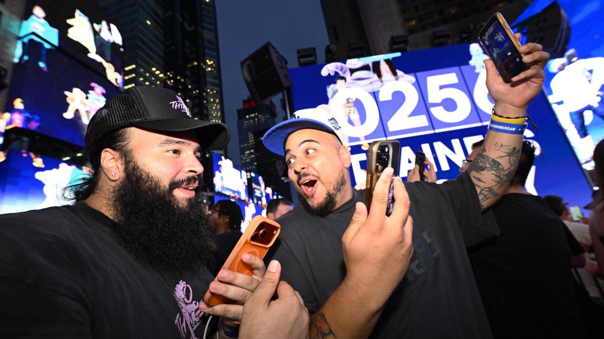 Image caption,Pokémon Go players celebrated the game's 10th anniversary at the real-world event in Times Square on Thursday