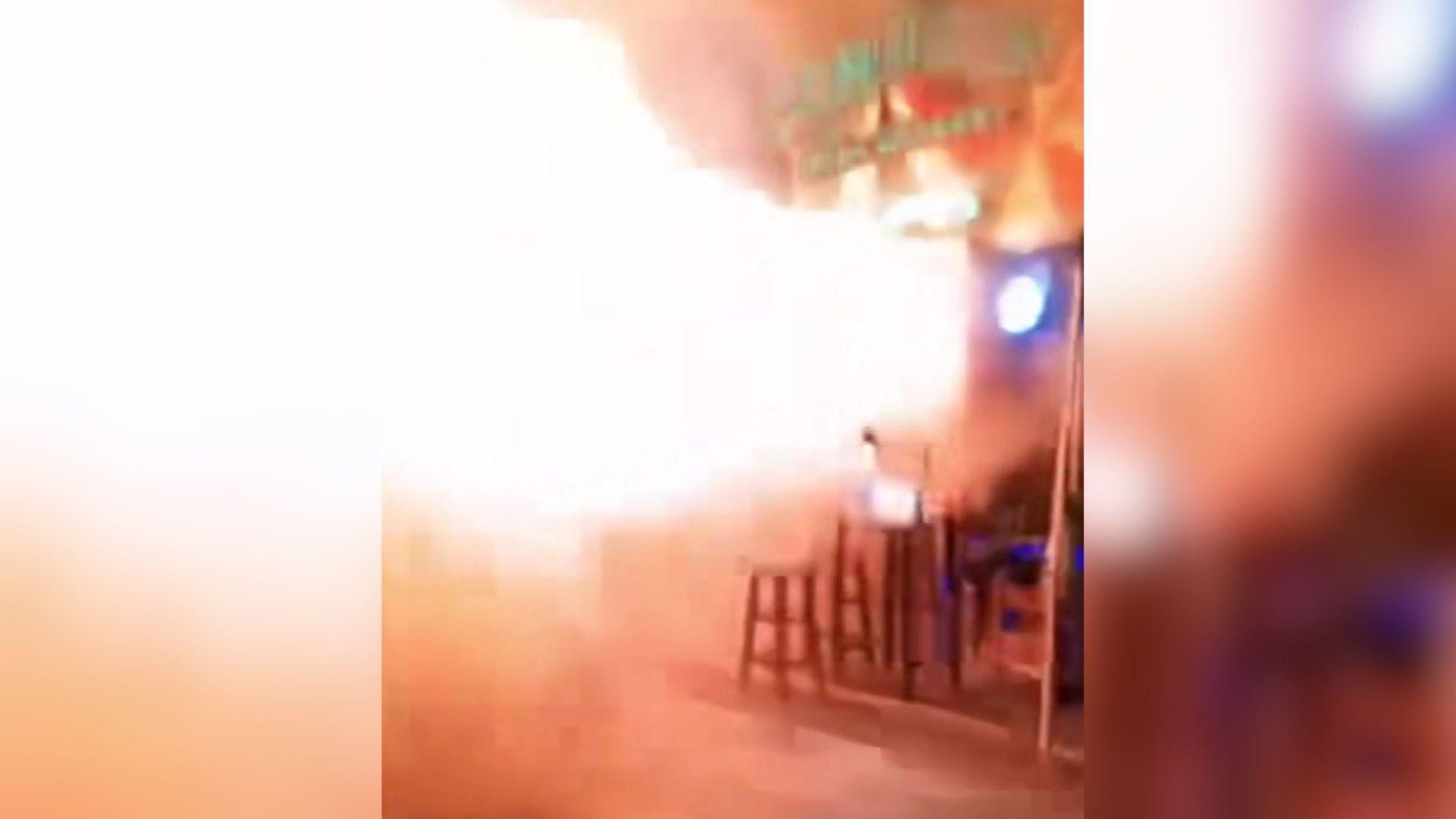 Image caption,Pictures from inside the bar after the fire show the furniture, walls and ceiling blackened by the flames
