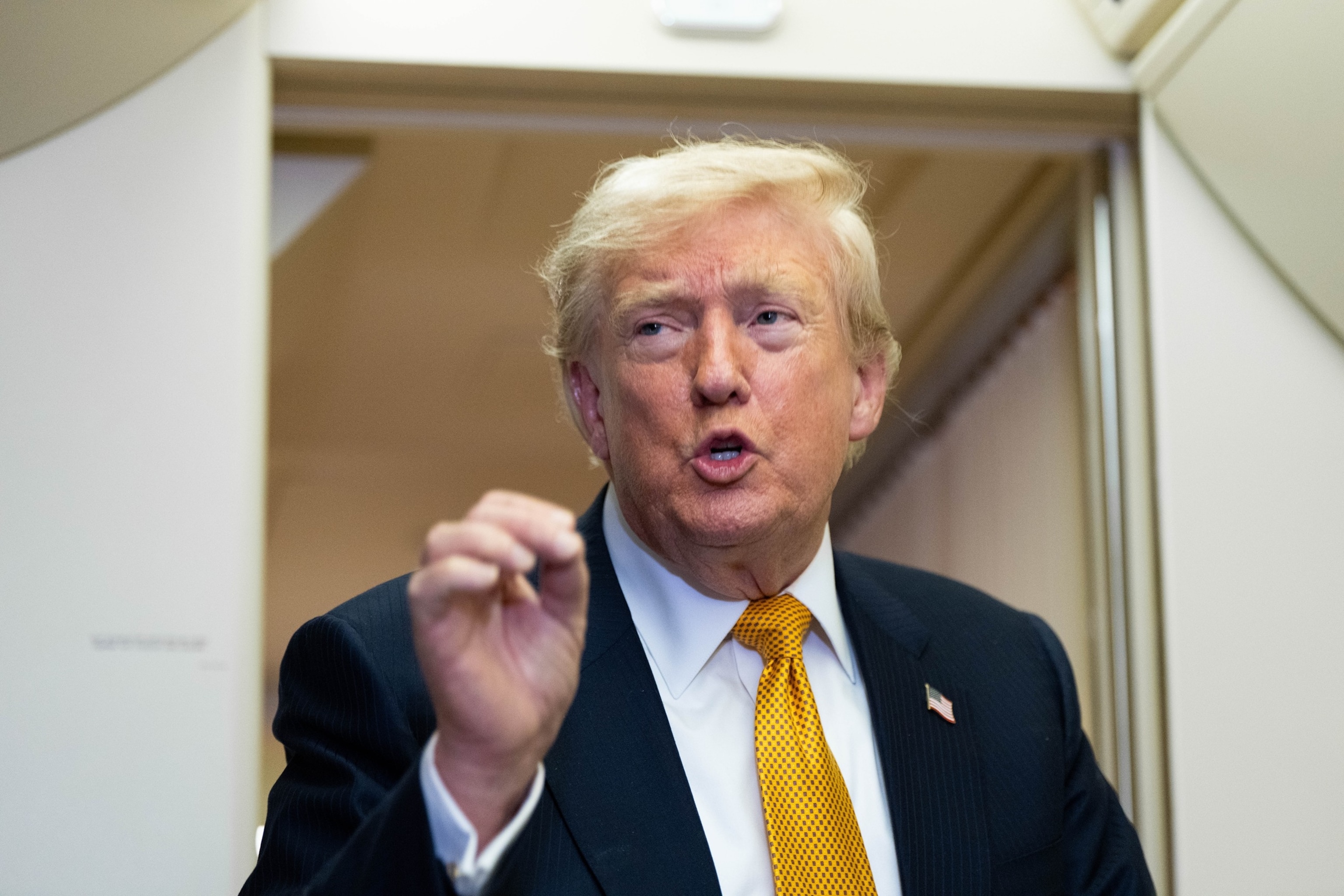 President Donald Trump speaks with the media aboard Air Force One shortly after departure from Mildenhall Air Force Base in the United Kingdom, after he switched from the old VC-25A Air Force One enroute to Washington, July 8, 2026.Alex Brandon/AP Photo