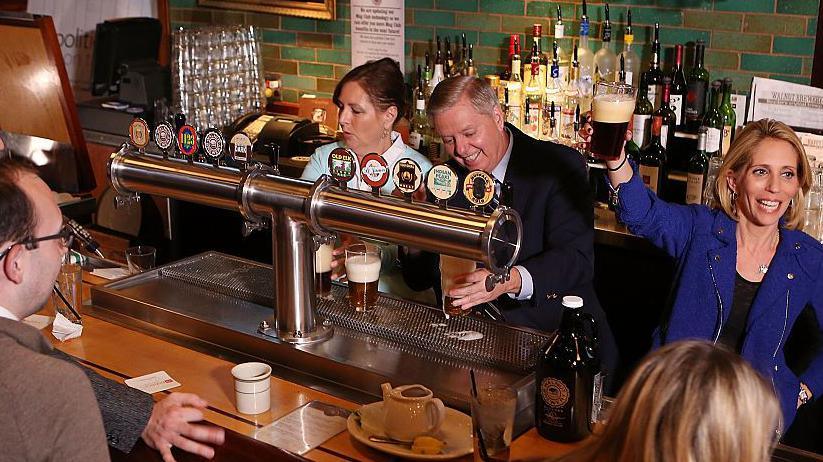 Image caption,Graham and Nordone, whose parents had owned a bar, seen serving pints during a 2015 campaign event