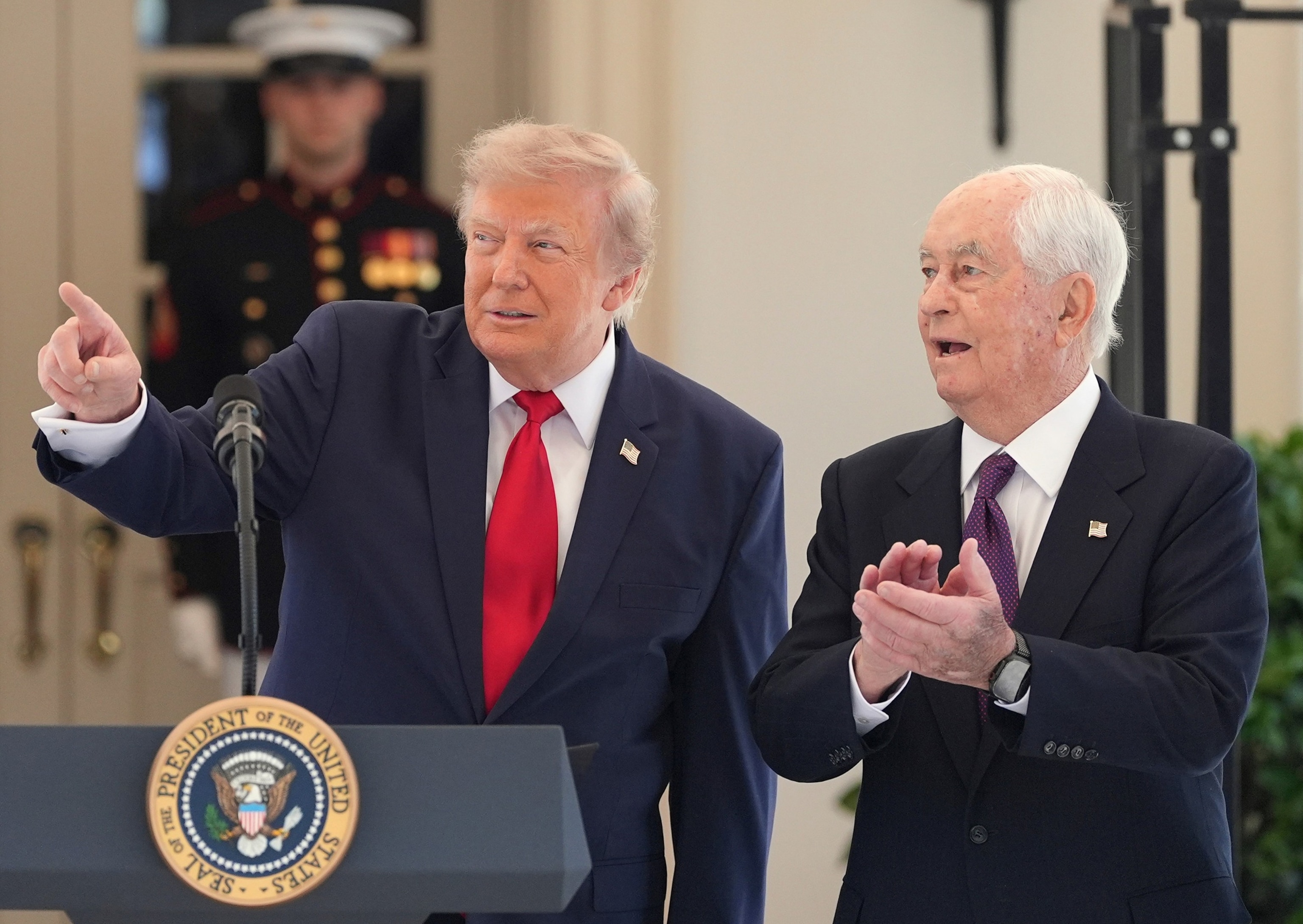 President Donald Trump speaks as Roger Penske, chairperson and founder of Penske Corp., at the White House during a showcase for the upcoming Freedom 250 Grand Prix auto race, July 13, 2026, in Washington.Alex Brandon/AP Photo