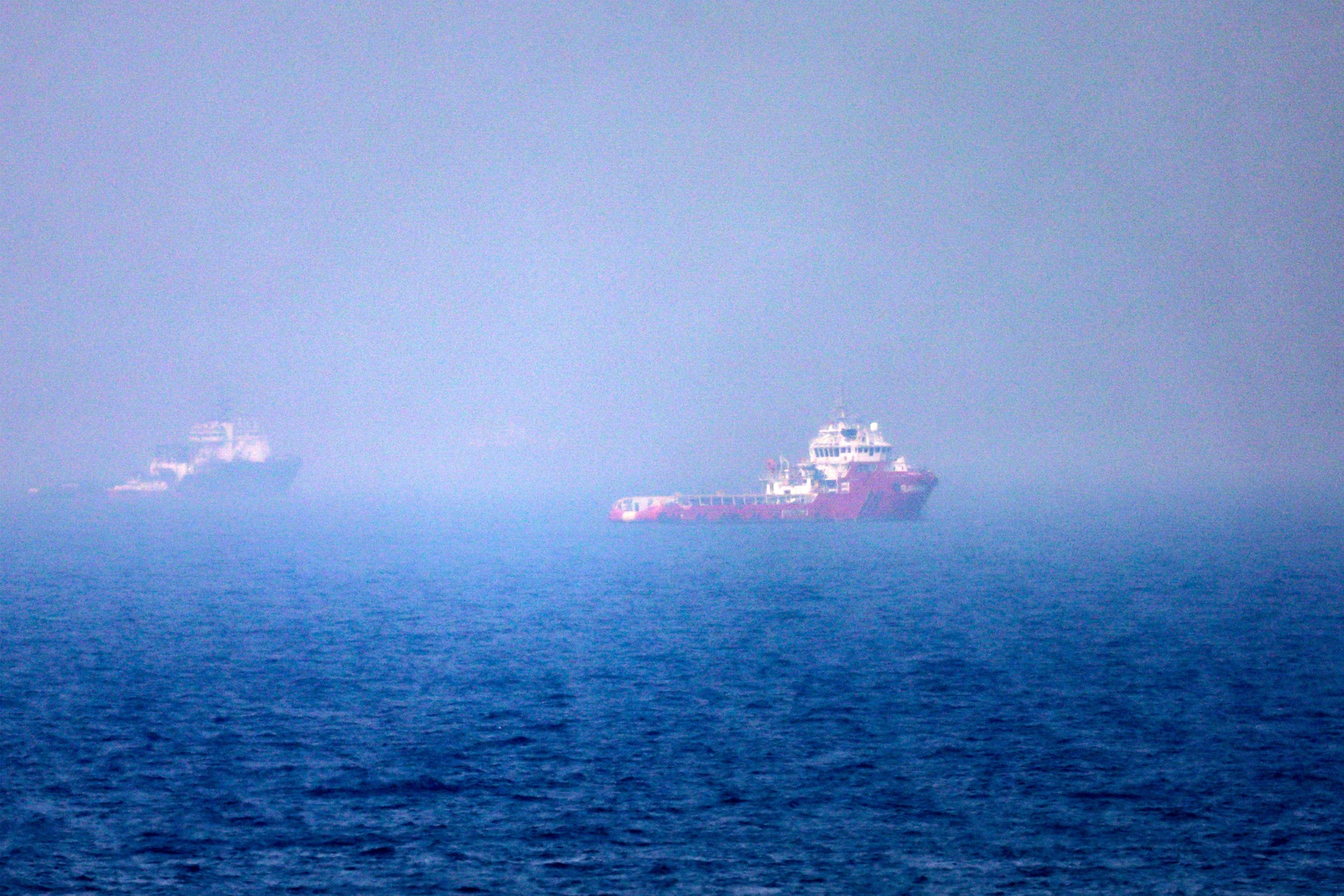 Ships sail near the Strait of Hormuz off the eastern coast of the United Arab Emirates at Khor Fakkan, July 13, 2026.AFP via Getty Images