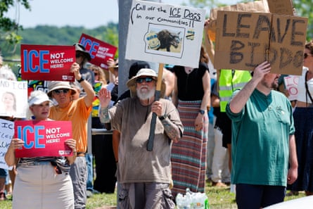 People hold placards as they take part in a protest in Biddeford.Photograph: CJ Gunther/Reuters