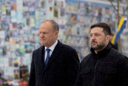 Donald Tusk and Volodymyr Zelenskyy visit a war memorial in Kyiv in February.Photograph: Ukrainian Presidential Press Service/Reuters