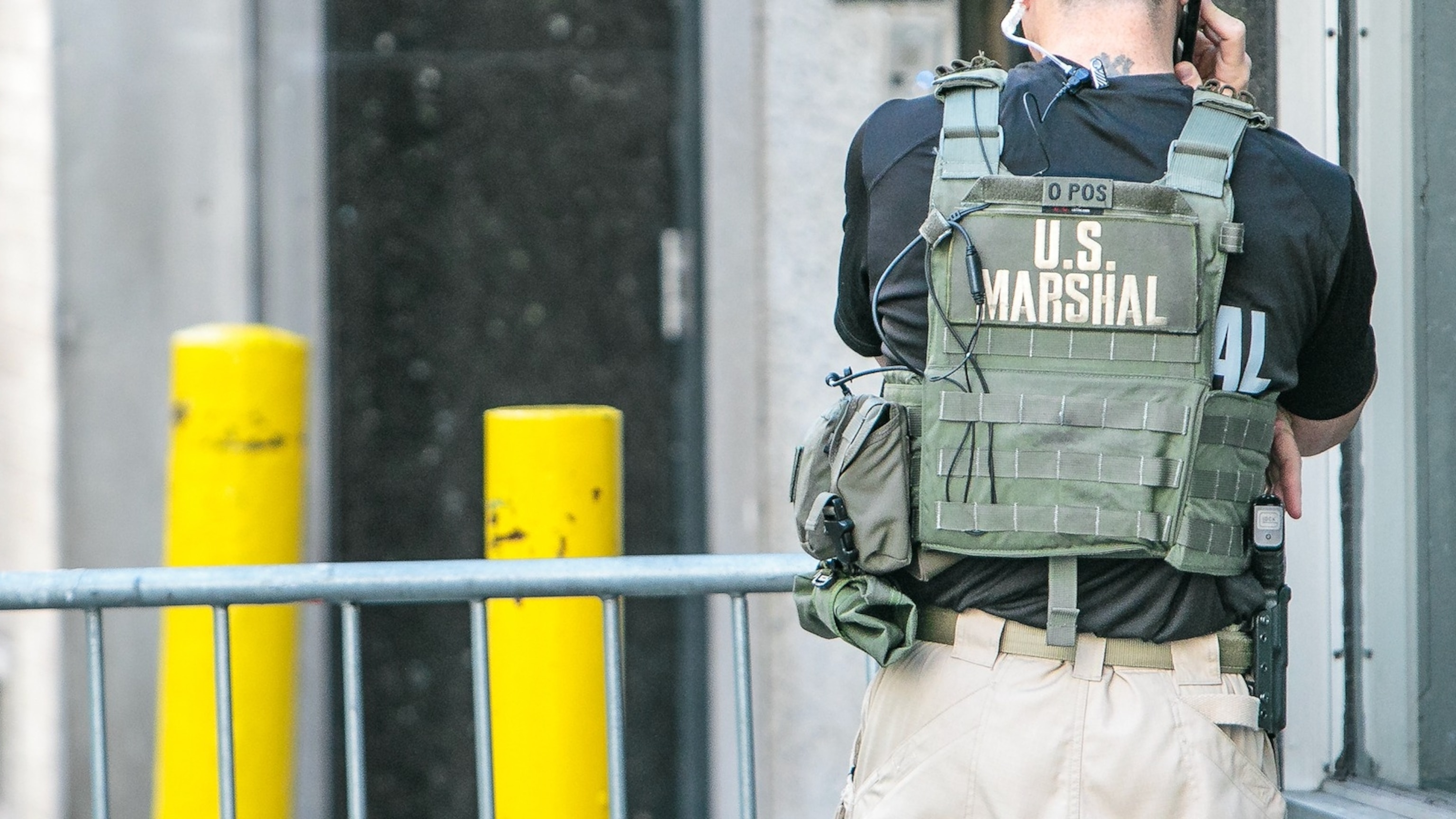 US marshal is talking on the phone while deployed to a police checkpoint near the UN headquarters Manhattan during General Assembly.Getty Images