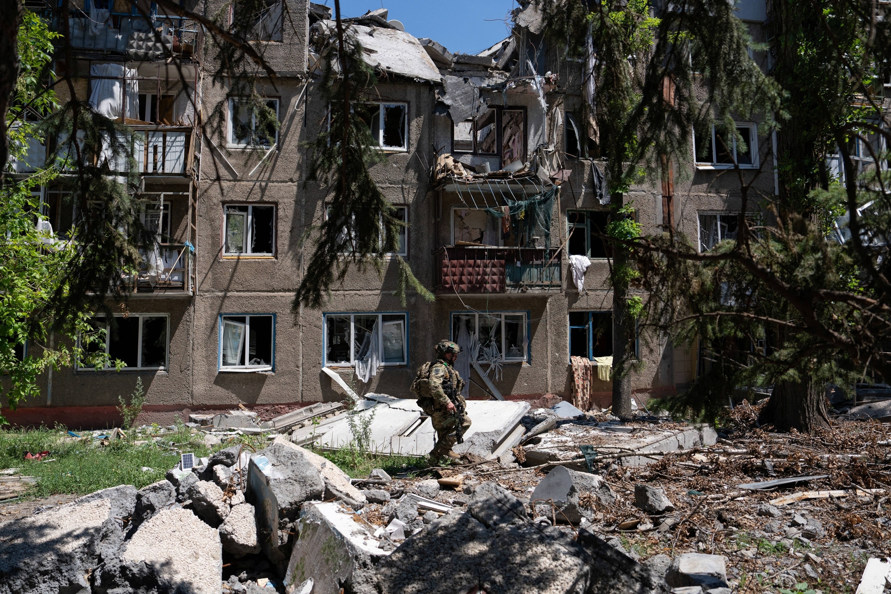In this handout photograph taken on July 2, 2026, and released on July 3, 2026, by the press service of the 93rd Kholodnyi Yar Separate Mechanized Brigade of the Ukrainian Ground Forces, a soldier patrols in the frontline town of Druzhkivka, in the Donetsk region.Handout/PRESS SERVICE OF THE 93RD KHOLOD